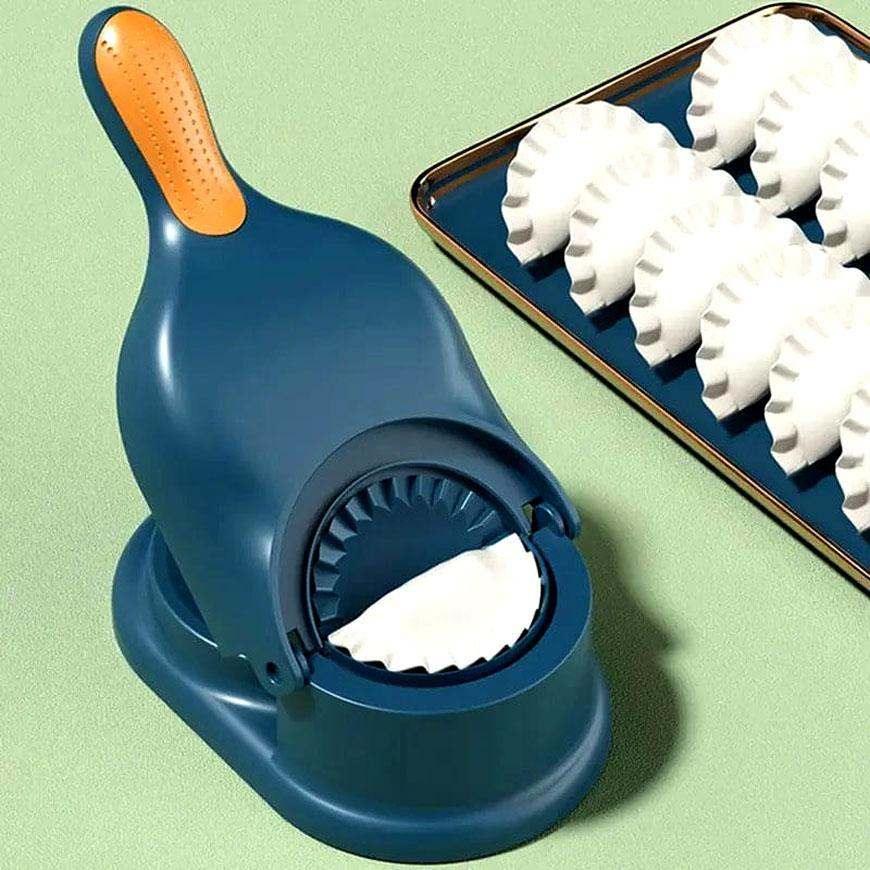 Compact blue dumpling wrapper tool made of durable ABS plastic with orange grip, shown with freshly sealed dumplings on a tray.